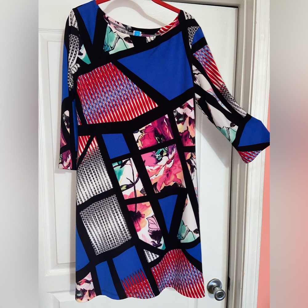 Never worn and no tags, woman’s mid length dress sz l.